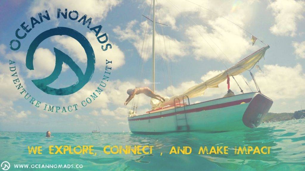 ocean nomads logo with a man jumping off a boat.