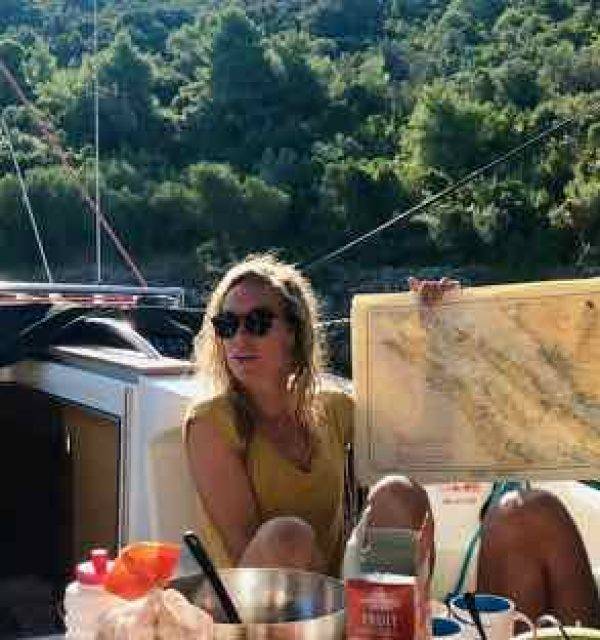 a group of people sitting on a boat with a map.